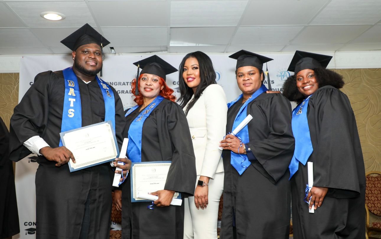 Drea Academy graduates in caps and gowns at their graduation ceremony